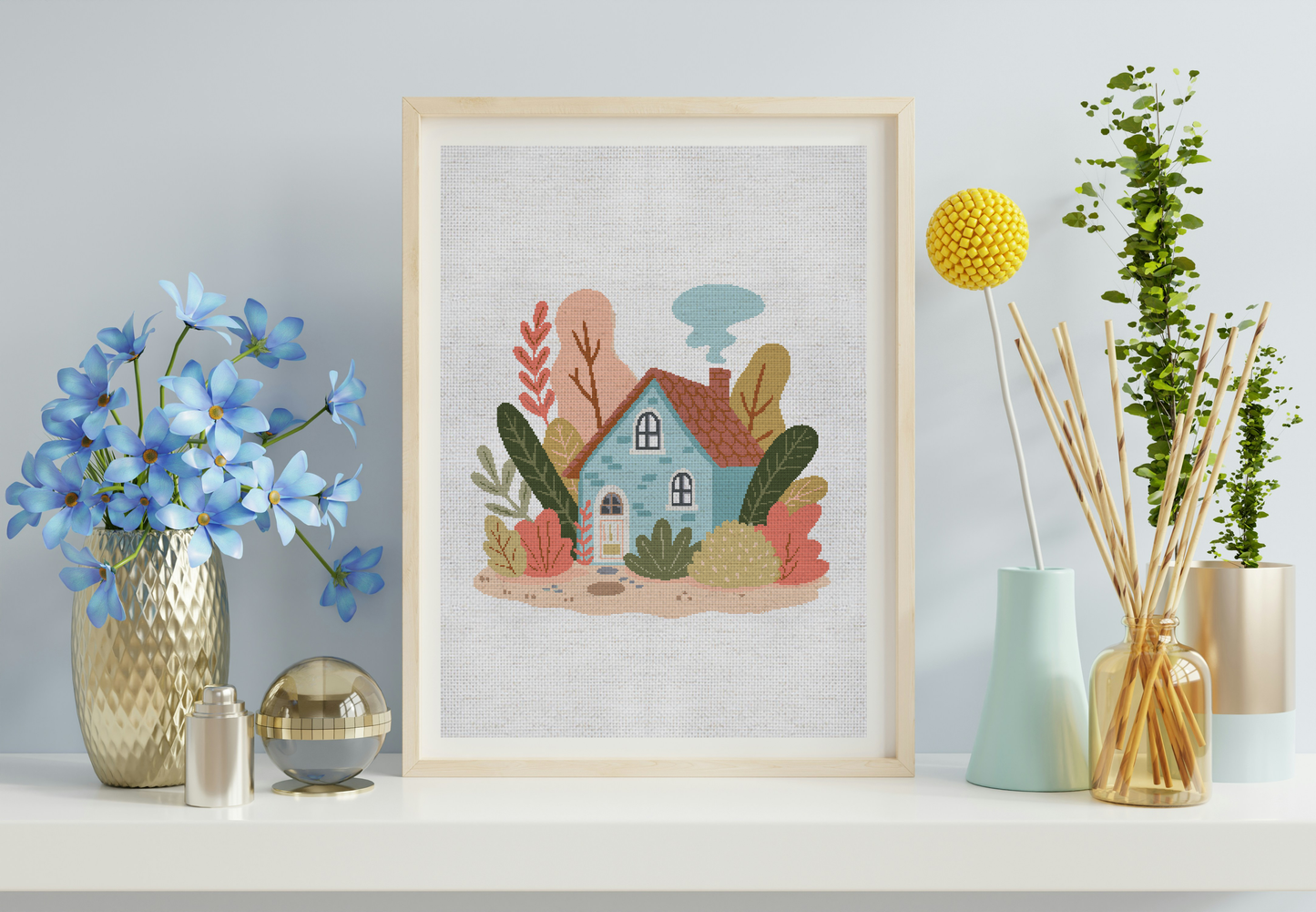 Framed artwork of a colorful house with plants on a shelf