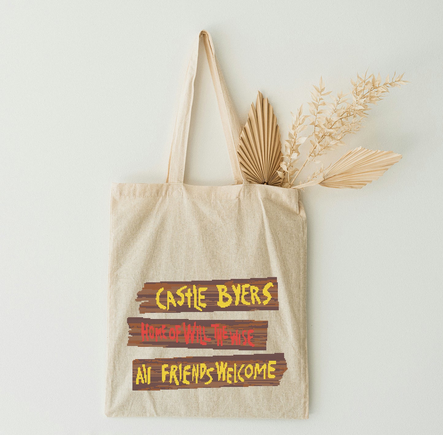 Beige tote bag on thew white wall