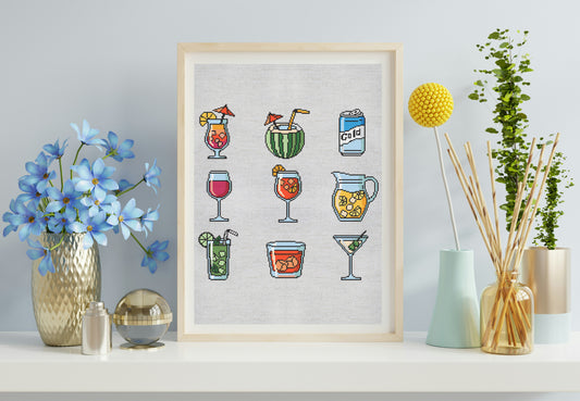 Framed artwork of colorful cocktails on a white wall with decorative items.