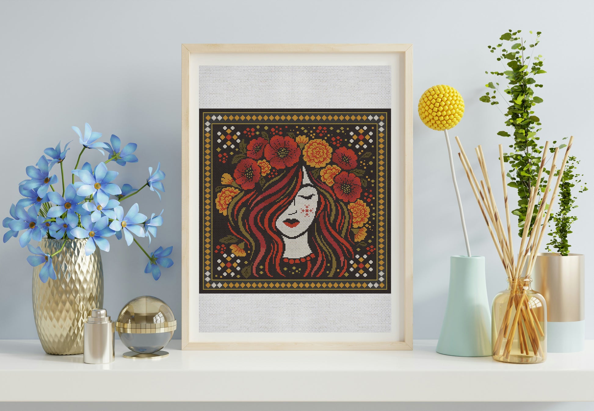 Framed artwork of a woman with flowers in her hair on a shelf with decorative items.