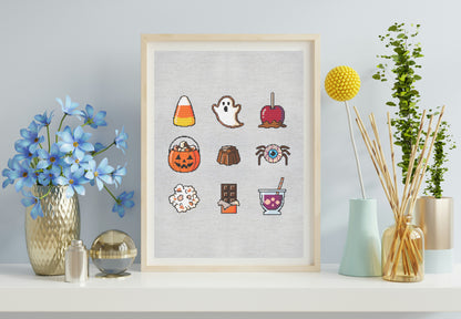 Framed artwork with colorful Halloween-themed stickers on a light gray wall.