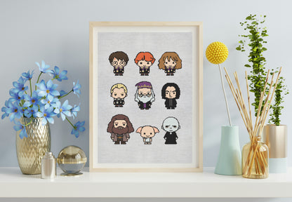 Framed cross-stitch art of cartoon characters on a shelf with decorative items.