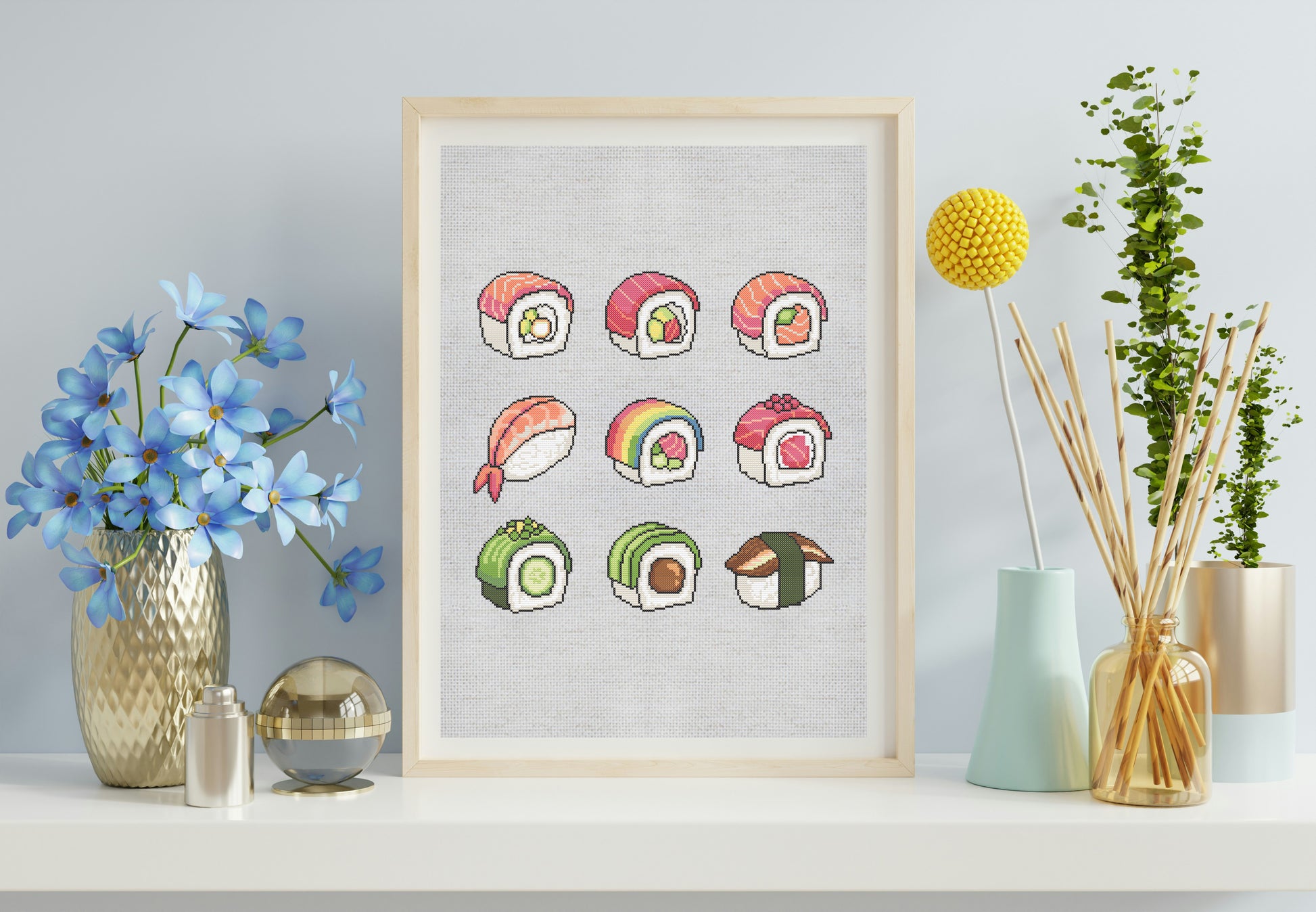 Framed artwork of colorful sushi illustrations on a wall with decorative vases and plants.