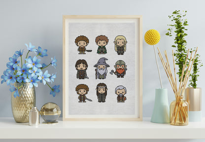 Framed cross-stitch art of characters on a wall with decorative items.