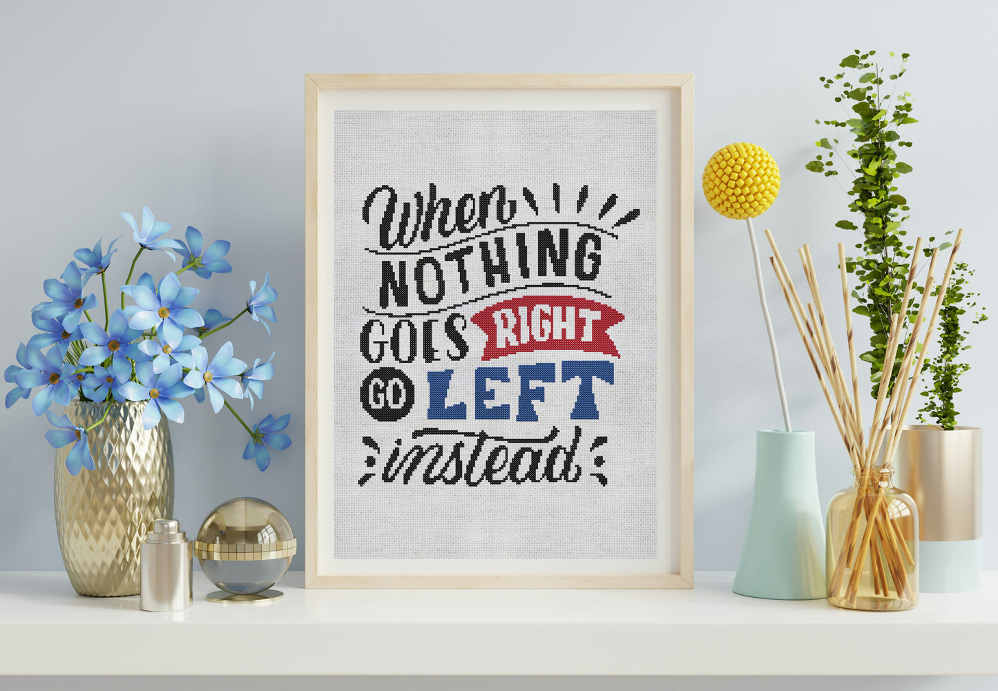 Framed motivational quote on a wall with decorative items
