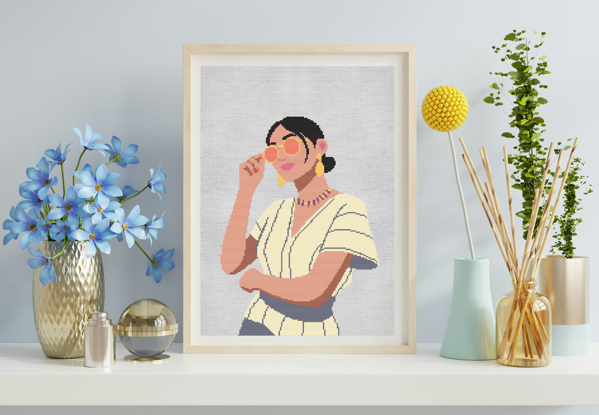 Framed artwork of a woman with flowers and decorative items on a shelf.