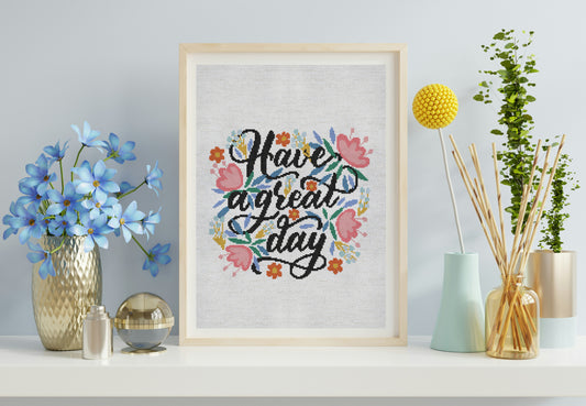 Decorative wall art with floral text design on a shelf with decorative items.
