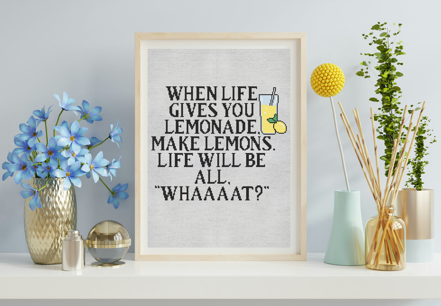 Framed motivational quote on a wall with decorative elements