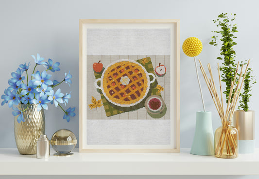 Framed artwork of a pie on a table with decorative items