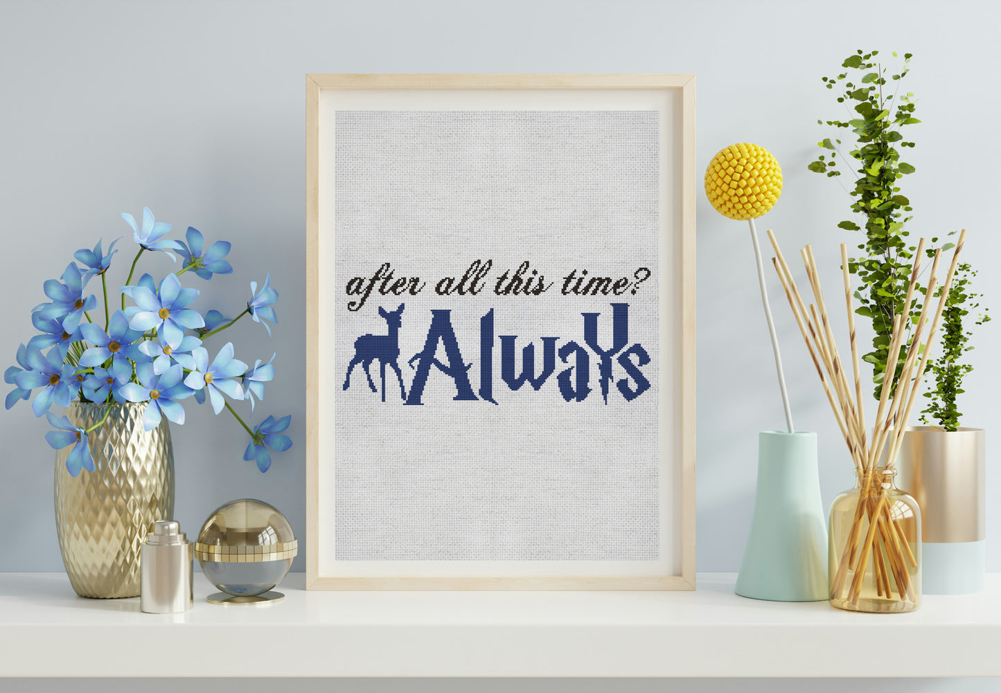 Framed print with 'After all this time? Always' text on a shelf with decorative items.