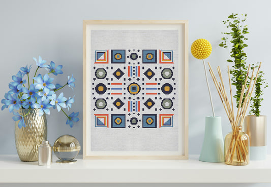 Framed geometric pattern on a wall with decorative items including flowers and vases.