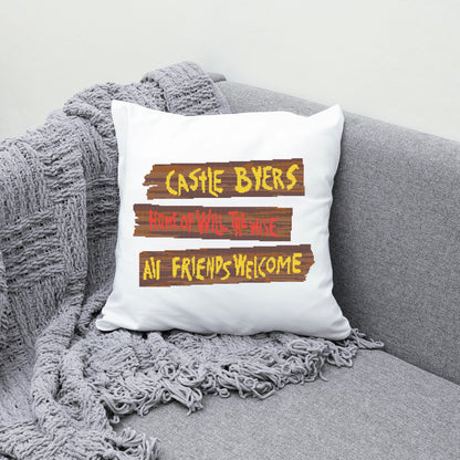 White pillow with text on a gray couch