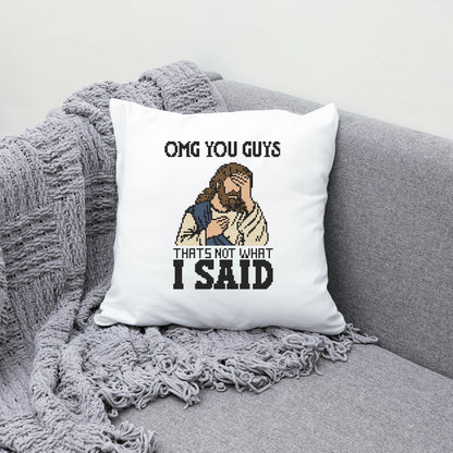 Pillow with a humorous design of a character and text on a gray couch.
