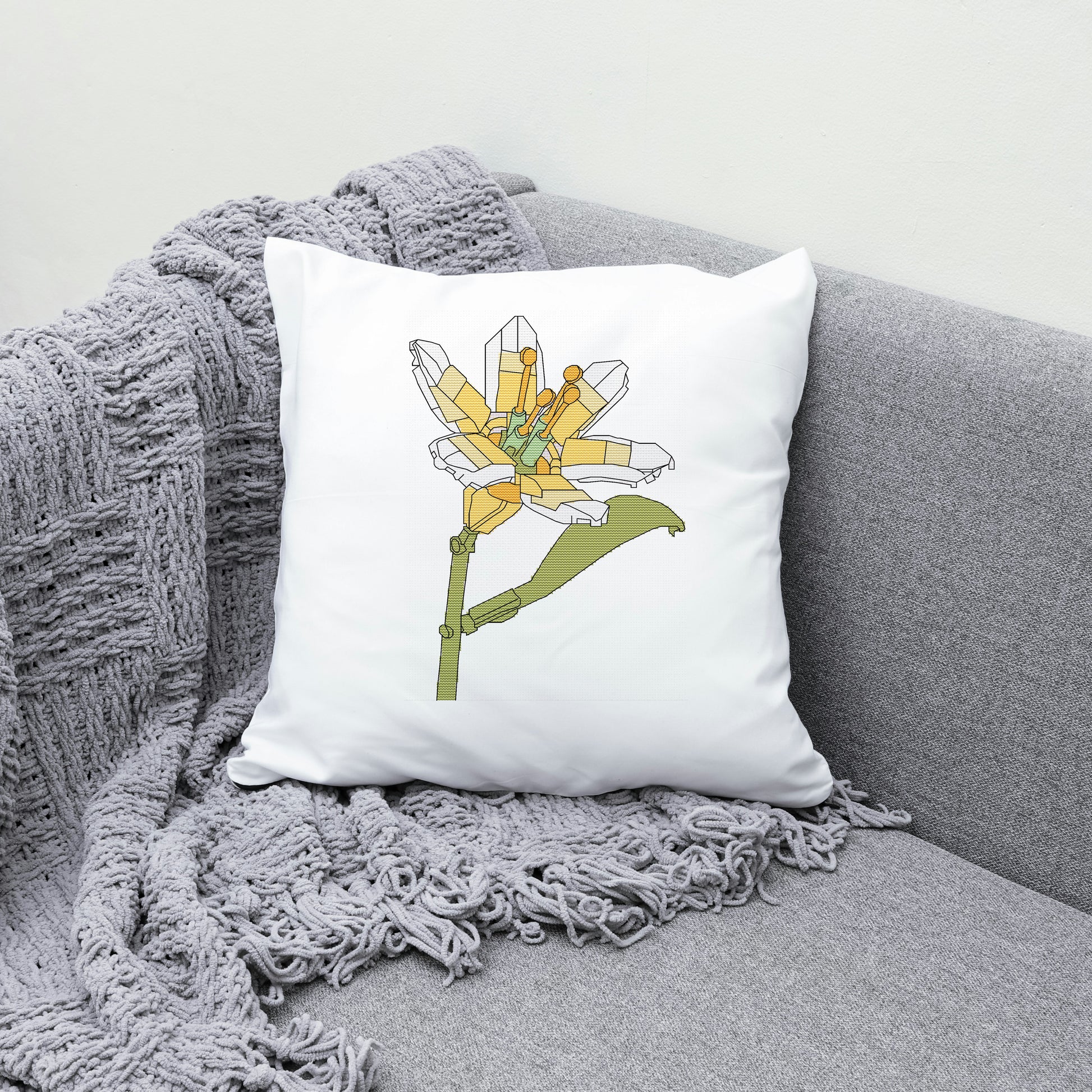 Decorative pillow with a floral design on a gray couch