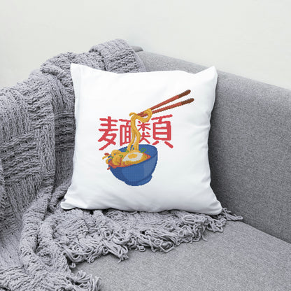 White pillow with a bowl of ramen design on a gray couch