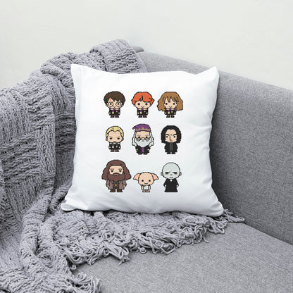 White pillow with pixel art character illustrations on a gray couch