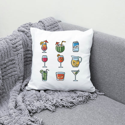 Decorative pillow with drink illustrations on a gray couch