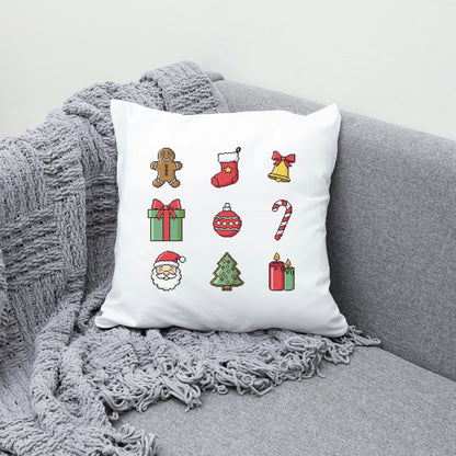 White pillow with Christmas-themed icons on a gray couch