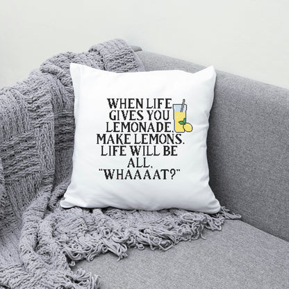White pillow with humorous quote on a gray couch