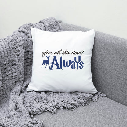 White pillow with 'After all this time? Always' text on a gray couch with a gray blanket.