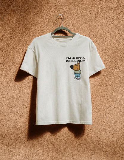White t-shirt with logo print hanging on the beige wall