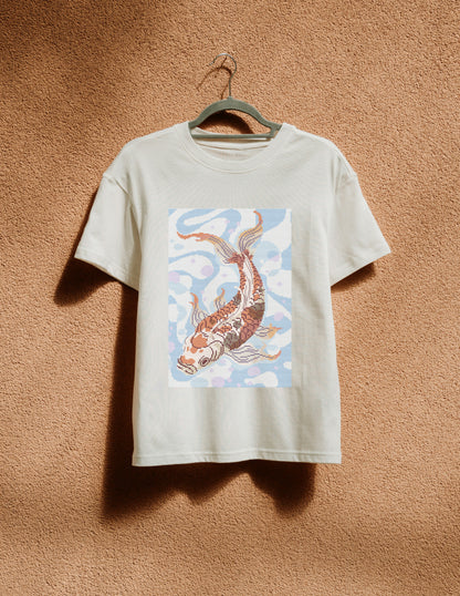 White t-shirt with a koi fish design on a beige background