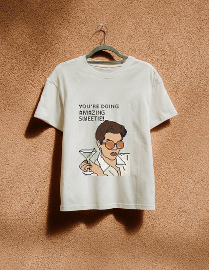 White t-shirt with graphic design and text on a beige background