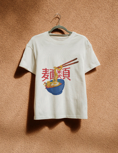 White t-shirt with a graphic design of noodles and chopsticks on a beige wall.
