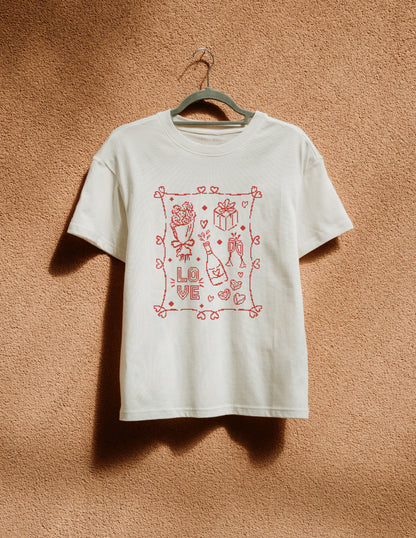White t-shirt with red graphic design on a hanger against a brown textured wall