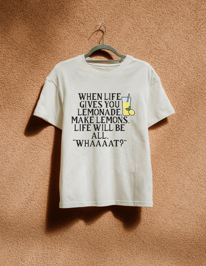 White t-shirt with humorous text design on a hanger against a textured brown wall.